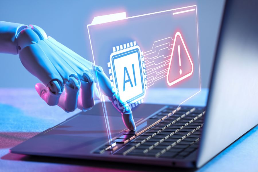 Une main robotique interagit avec le clavier d'un ordinateur portable sous une interface holographique affichant un outil d'intelligence artificielle.